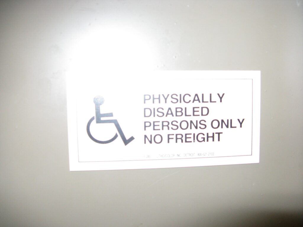 Sign: Physically disabled persons only, no freight